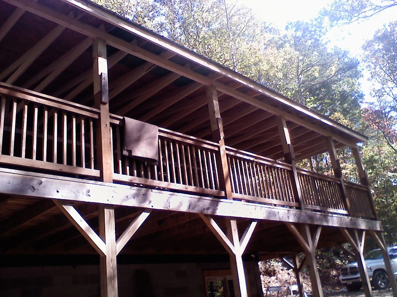 Timber framing under a new elevated porch and deck — Roof Leak Repair in Ellinwood by Roofing Brothers
